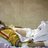 12-year old boy rests in a hospital bed after being wounded by a gunshot.