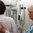 Lead Mammography Technologist assists a patient.