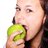 Pretty girl eating an apple.
