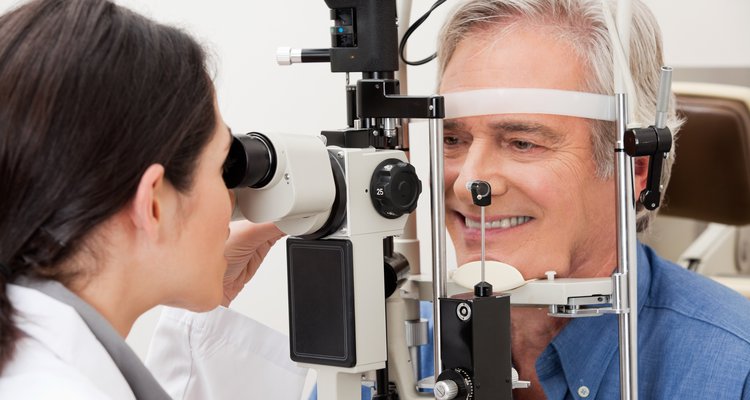 Healthcare provider performing visual field examination of the eye.