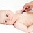 Pediatrician examining little baby girl with stethoscope for heart health