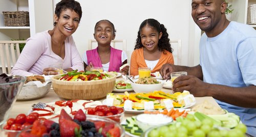 Family eating salad and healthy food.